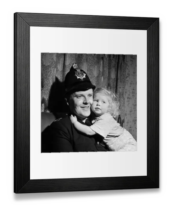 Framed Print : Two-year-old Deborah Almond, and PC Brian Corner, who rescued the toddler from a river