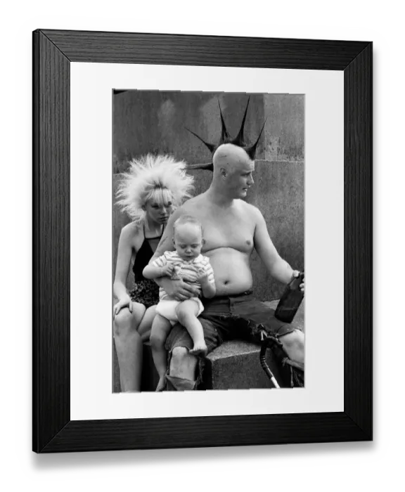 Framed Print : Punk rocker Jock and his young son William enjoying the warm weather in Trafalgar Square Framed Print : Punk rocker Jock and his young son William enjoying the warm weather in Trafalgar Square