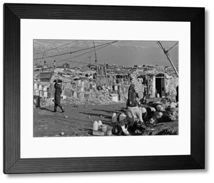 Framed Print : Shanty town on the eastern edge of Tehran, where open sewers run past houses made of mud Framed Print : Shanty town on the eastern edge of Tehran, where open sewers run past houses made of mud