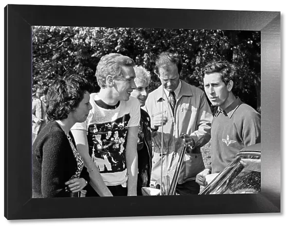Prince Charles meet Punks Anne Wobble, 17, Tony Waterman, 17, and Phil Sick, 19