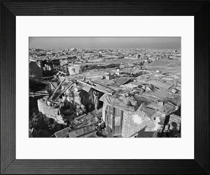 Framed Print : Shanty town on the eastern edge of Tehran, where open sewers run past houses made of mud Framed Print : Shanty town on the eastern edge of Tehran, where open sewers run past houses made of mud