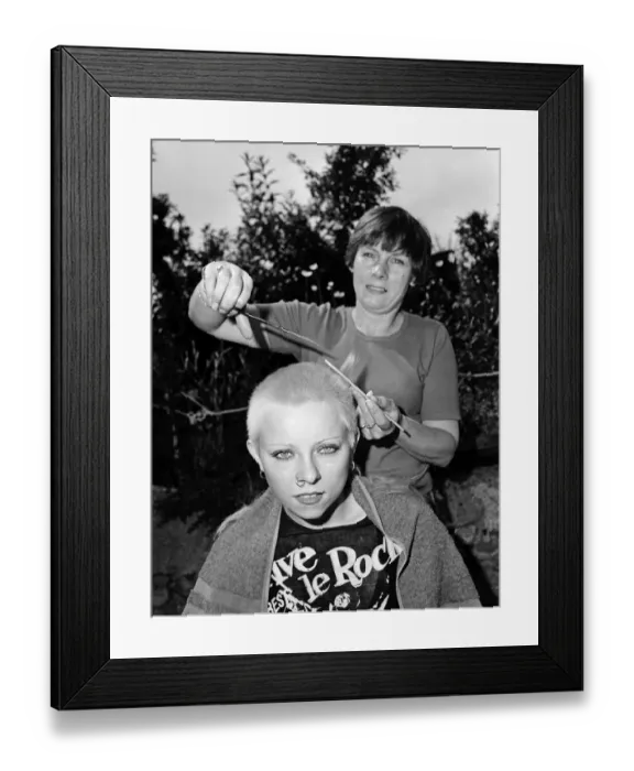 Framed Print : Punk girl Julie Brandon having her hair cut by her mother at their home in Thame