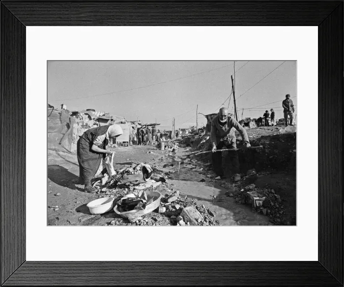 Framed Print : Shanty town on the eastern edge of Tehran, where open sewers run past houses made of mud