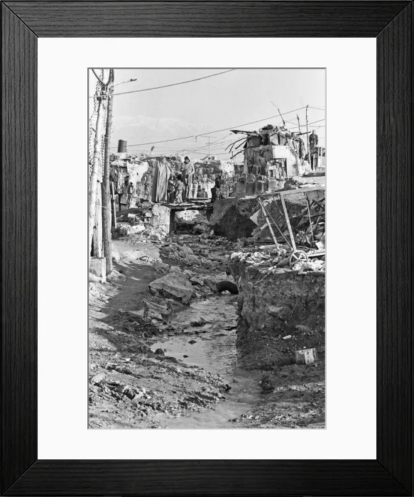 Framed Print : Shanty town on the eastern edge of Tehran, where open sewers run past houses made of mud Framed Print : Shanty town on the eastern edge of Tehran, where open sewers run past houses made of mud