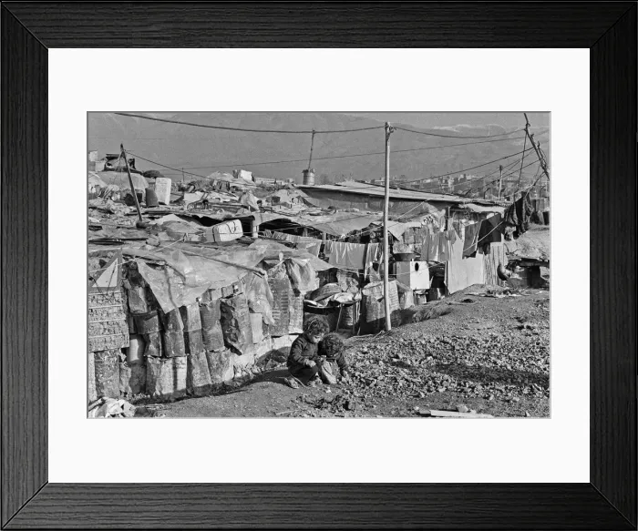Framed Print : Shanty town on the eastern edge of Tehran, where open sewers run past houses made of mud Framed Print : Shanty town on the eastern edge of Tehran, where open sewers run past houses made of mud