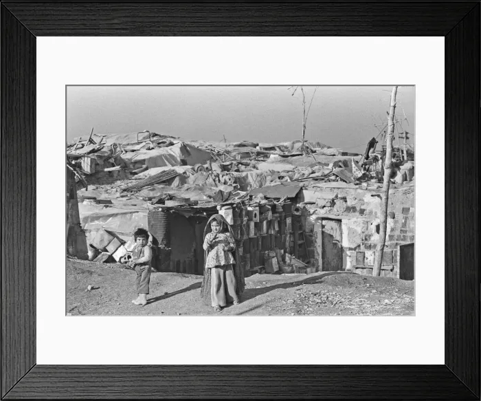 Framed Print : Shanty town on the eastern edge of Tehran, where open sewers run past houses made of mud Framed Print : Shanty town on the eastern edge of Tehran, where open sewers run past houses made of mud