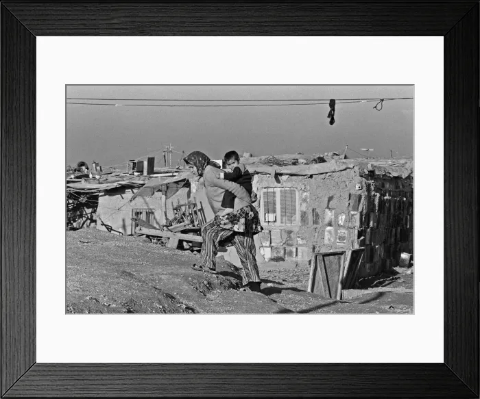 Framed Print : Shanty town on the eastern edge of Tehran, where open sewers run past houses made of mud Framed Print : Shanty town on the eastern edge of Tehran, where open sewers run past houses made of mud