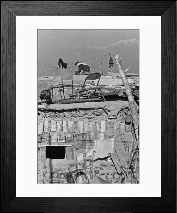 Framed Print : Shanty town on the eastern edge of Tehran, where open sewers run past houses made of mud Framed Print : Shanty town on the eastern edge of Tehran, where open sewers run past houses made of mud