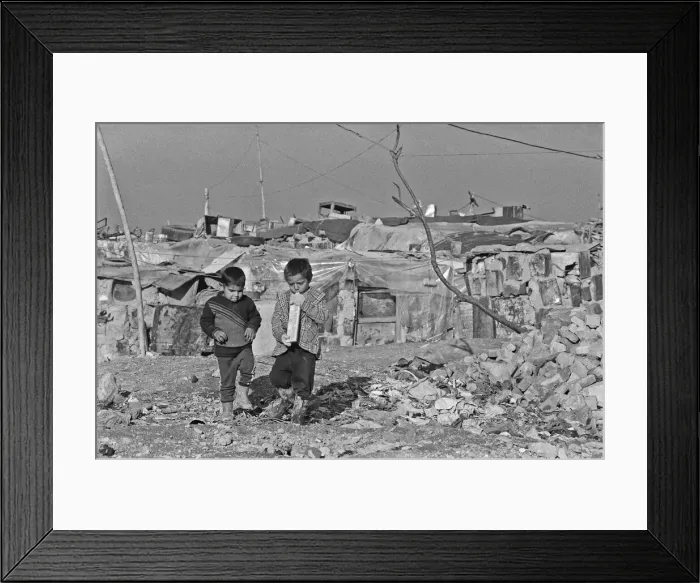 Framed Print : Shanty town on the eastern edge of Tehran, where open sewers run past houses made of mud Framed Print : Shanty town on the eastern edge of Tehran, where open sewers run past houses made of mud