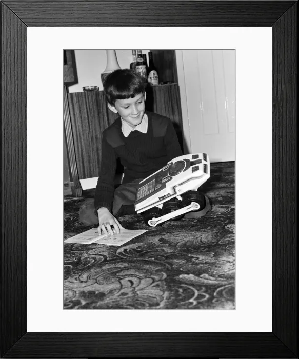 Framed Print : Electronic childrens toys. Pictured, 11 year old Andrew with the Big trak Electronic