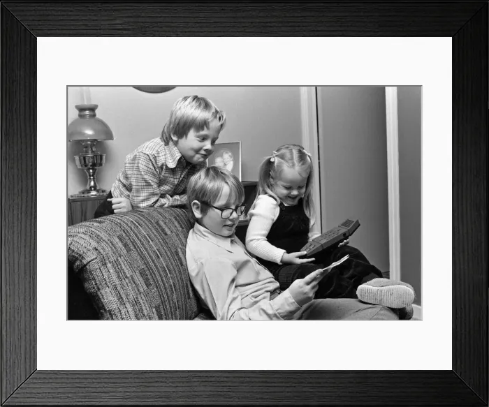 Framed Print : Electronic childrens toys. Pictured, children with a Merlin Electronic games machine Framed Print : Electronic childrens toys. Pictured, children with a Merlin Electronic games machine