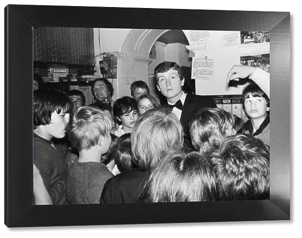 Snooker player Steve Davis with a group of young fans. 8th June 1981