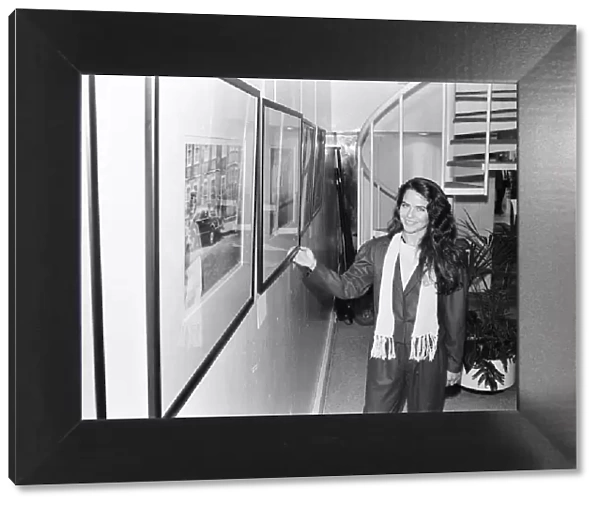 Koo Stark, Actress poses next to a print taken by herself