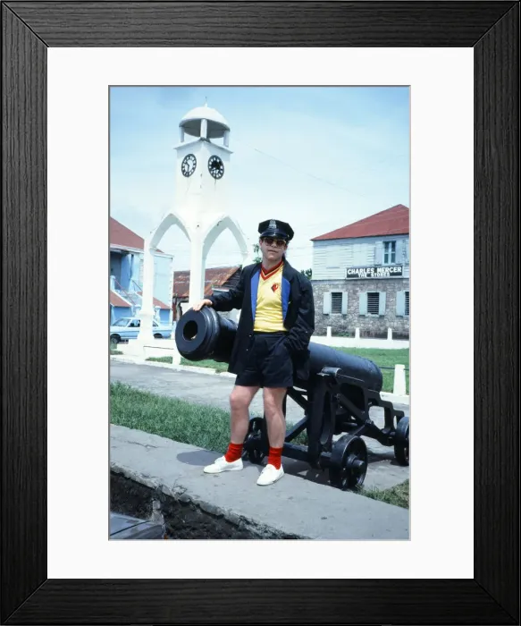Framed Print : Elton John wearing a Watford F. C. shirt on the Caribbean island of Montserrat