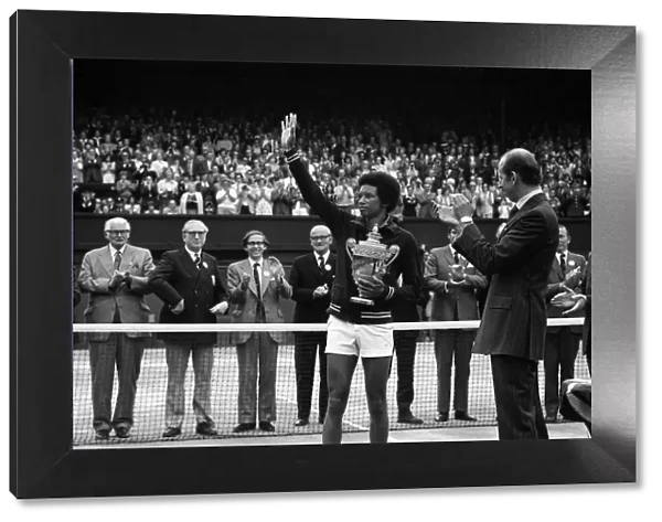 Arthur Ashe receives the trophy from the Duke of Kent after he defeated the defending