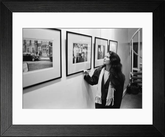 Framed Print : Koo Stark, Actress poses next to a print taken by herself Framed Print : Koo Stark, Actress poses next to a print taken by herself