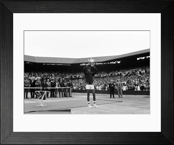 Framed Print : Arthur Ashe with the Wimbledon trophy after he beat the defending champion Jimmy Connors Framed Print : Arthur Ashe with the Wimbledon trophy after he beat the defending champion Jimmy Connors