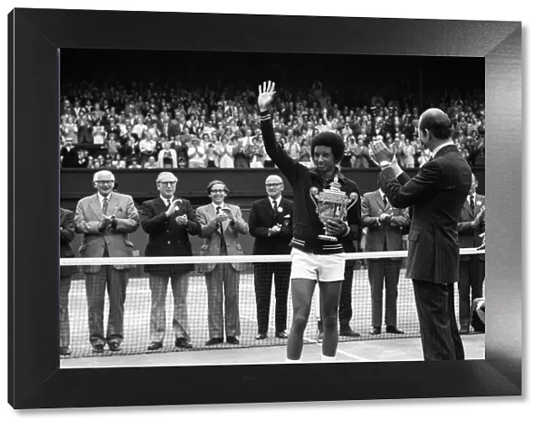 Arthur Ashe receives the trophy from the Duke of Kent after he defeated the defending
