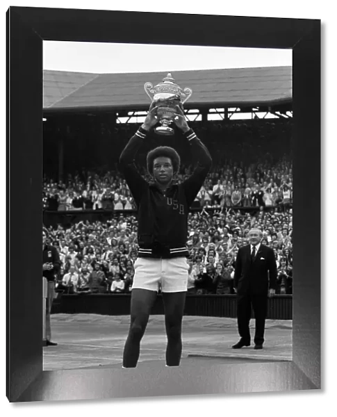Arthur Ashe with the Wimbledon trophy after he beat the defending champion Jimmy Connors