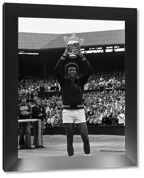 Arthur Ashe with the Wimbledon trophy after he beat the defending champion Jimmy Connors