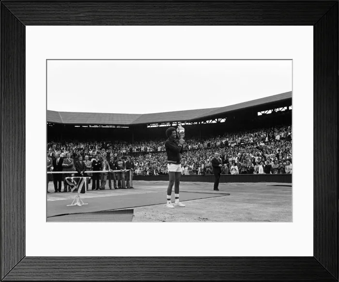 Framed Print : Arthur Ashe with the Wimbledon trophy after he beat the defending champion Jimmy Connors Framed Print : Arthur Ashe with the Wimbledon trophy after he beat the defending champion Jimmy Connors