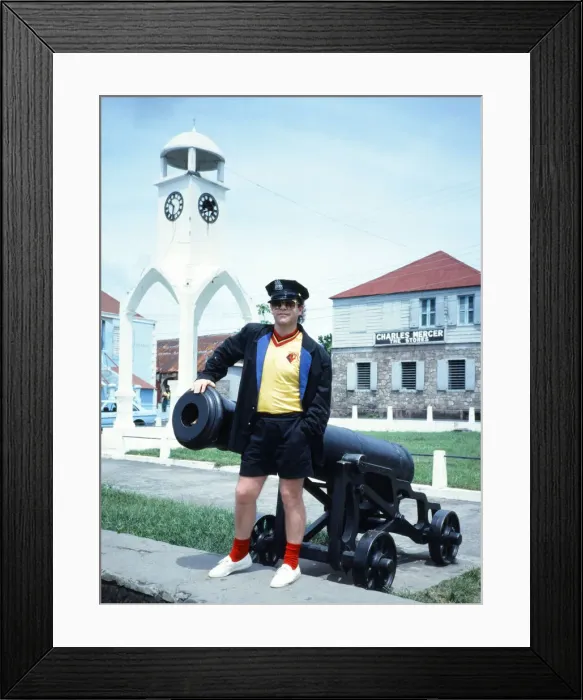 Framed Print : Elton John wearing a Watford F. C. shirt on the Caribbean island of Montserrat Framed Print : Elton John wearing a Watford F. C. shirt on the Caribbean island of Montserrat