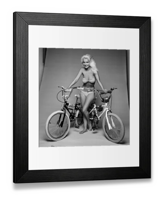 Framed Print : A model with two BMX bicycles. August 1984