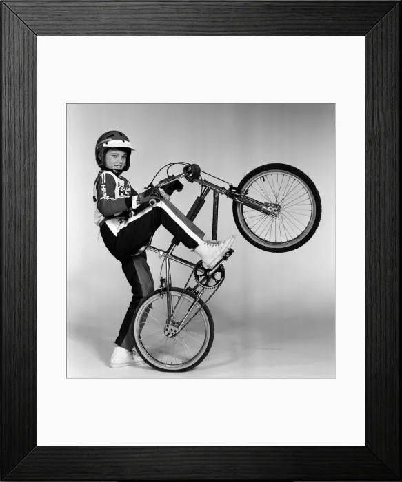 Framed Print : A boy with a BMX bike and wearing a BMX outfit. 25th November 1983 Framed Print : A boy with a BMX bike and wearing a BMX outfit. 25th November 1983