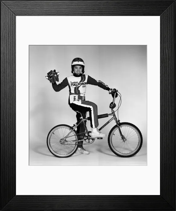 Framed Print : A boy with a BMX bike and wearing a BMX outfit. 25th November 1983