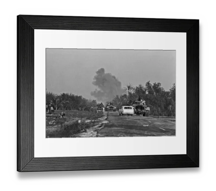 Framed Print : Smoke rising in the distance as armoured units of the South Vietnamese army shell Viet