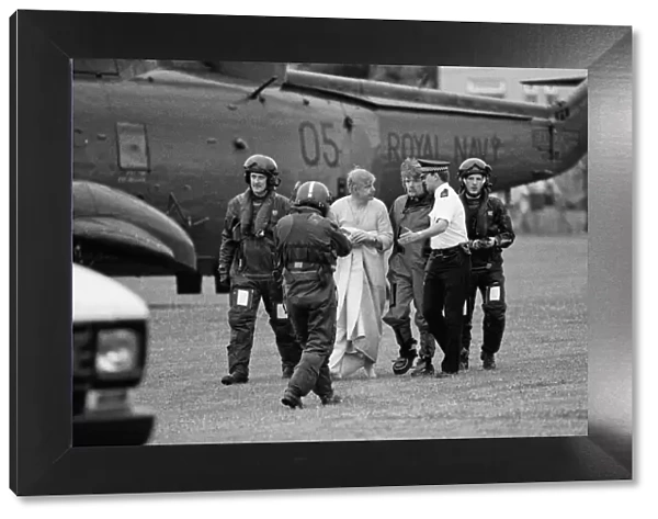 Richard Branson pictured centre walking with the policeman