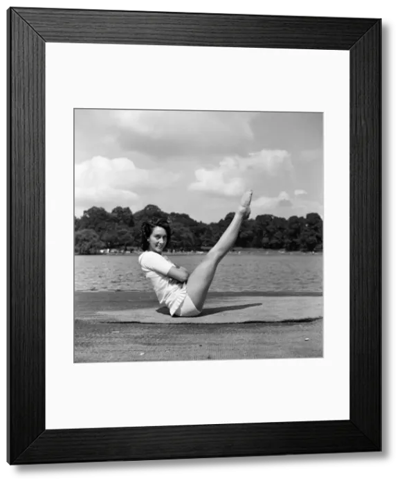 Framed Print : Dancer Gillian Lynne has her own idea of a sitting position whilst taking the sun Framed Print : Dancer Gillian Lynne has her own idea of a sitting position whilst taking the sun