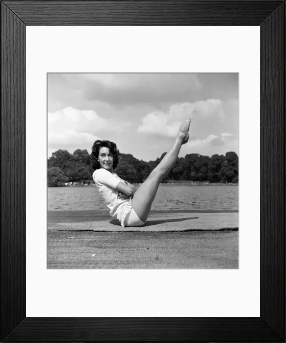 Framed Print : Dancer Gillian Lynne has her own idea of a sitting position whilst taking the sun Framed Print : Dancer Gillian Lynne has her own idea of a sitting position whilst taking the sun
