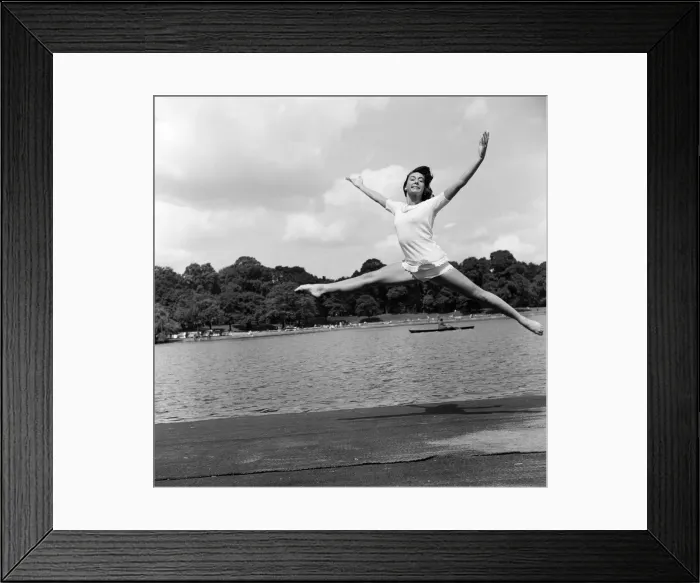 Framed Print : Dancer Gillian Lynne has her own idea of a sitting position whilst taking the sun Framed Print : Dancer Gillian Lynne has her own idea of a sitting position whilst taking the sun