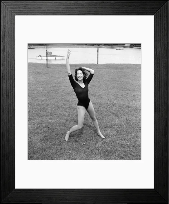 Framed Print : Dancer Gillian Lynne has her own idea of a sitting position whilst taking the sun Framed Print : Dancer Gillian Lynne has her own idea of a sitting position whilst taking the sun