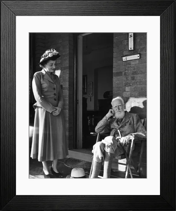 Framed Print : Playwright George Bernard Shaw visited by Miss Frances Rowe who came to offer him an Framed Print : Playwright George Bernard Shaw visited by Miss Frances Rowe who came to offer him an