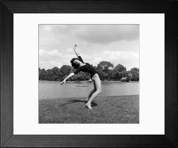 Framed Print : Dancer Gillian Lynne has her own idea of a sitting position whilst taking the sun Framed Print : Dancer Gillian Lynne has her own idea of a sitting position whilst taking the sun