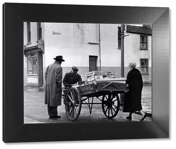 Fishmonger Tommy Letton with his barrow in Butetown, Cardiff. 16th February 1960