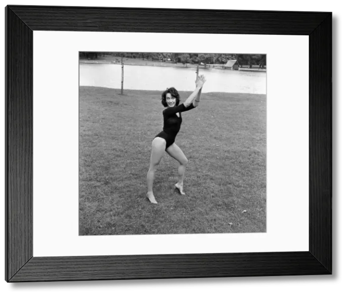Framed Print : Dancer Gillian Lynne has her own idea of a sitting position whilst taking the sun Framed Print : Dancer Gillian Lynne has her own idea of a sitting position whilst taking the sun