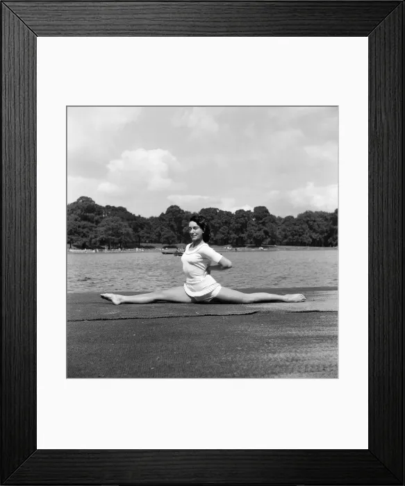 Framed Print : Dancer Gillian Lynne has her own idea of a sitting position whilst taking the sun Framed Print : Dancer Gillian Lynne has her own idea of a sitting position whilst taking the sun