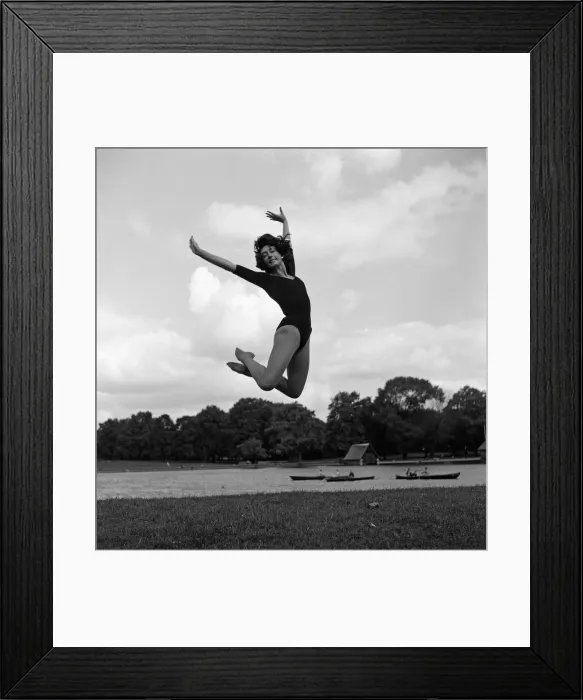 Framed Print : Dancer Gillian Lynne has her own idea of a sitting position whilst taking the sun Framed Print : Dancer Gillian Lynne has her own idea of a sitting position whilst taking the sun
