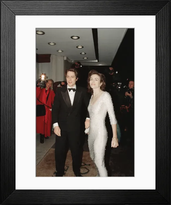 Framed Print : Hugh Grant and his girlfriend, model and actor Elizabeth Hurley arrive for The London Framed Print : Hugh Grant and his girlfriend, model and actor Elizabeth Hurley arrive for The London