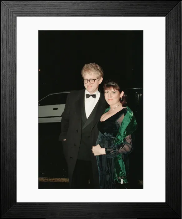 Framed Print : Richard Curtis and his partner Emma Freud arrive for The London Film Critics Circle