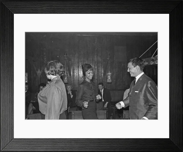Framed Print : Playboy, film maker and night club owner Rolf Eden, seen here dancing with one of Framed Print : Playboy, film maker and night club owner Rolf Eden, seen here dancing with one of