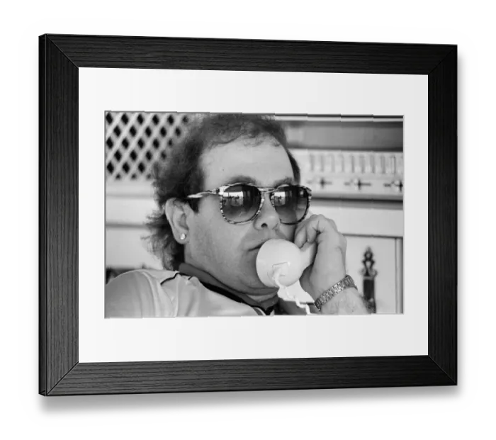 Framed Print : Elton John wearing a Watford F. C. shirt on the Caribbean island of Montserrat