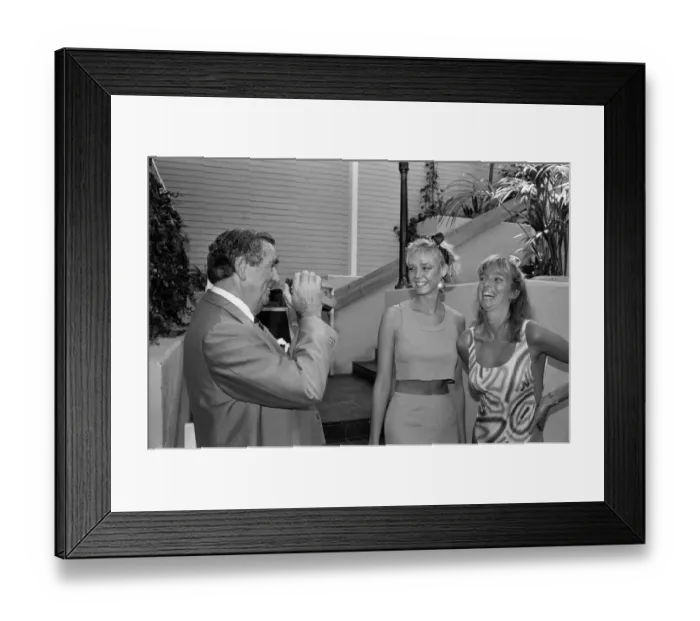 Framed Print : Politician and keen photographer Denis Healey tries out the new Polaroid camera