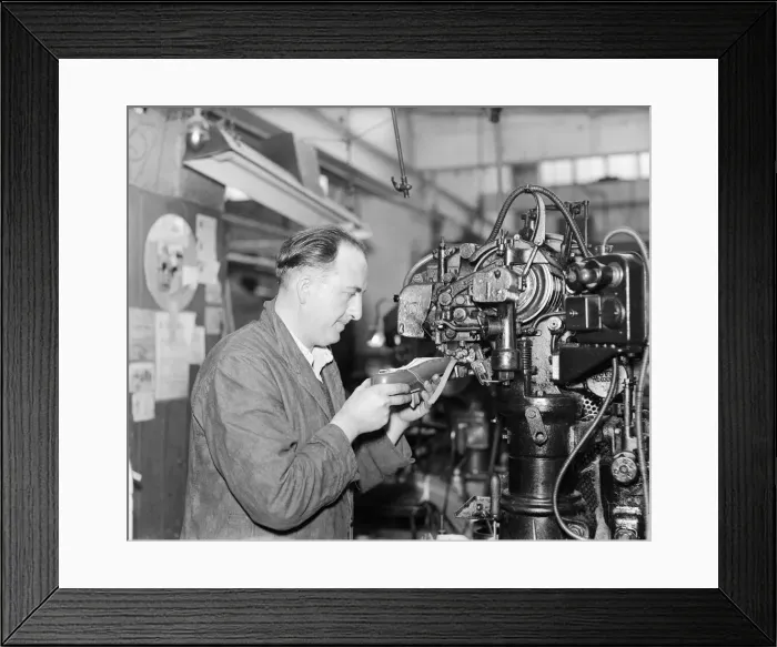 Framed Print : A worker at the Mansfield shoe factory in Northampton stitching a leather upper before Framed Print : A worker at the Mansfield shoe factory in Northampton stitching a leather upper before