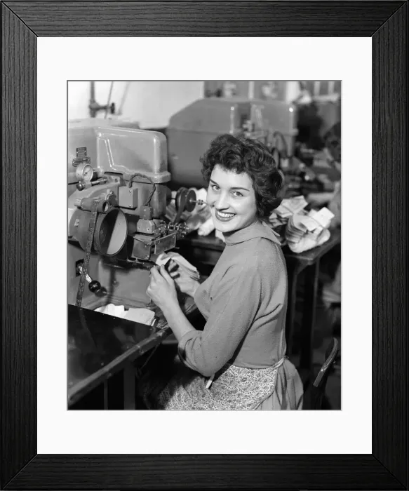 Framed Print : Worker at the Mansfield shoe factory in Northampton operating a labelling machine Framed Print : Worker at the Mansfield shoe factory in Northampton operating a labelling machine
