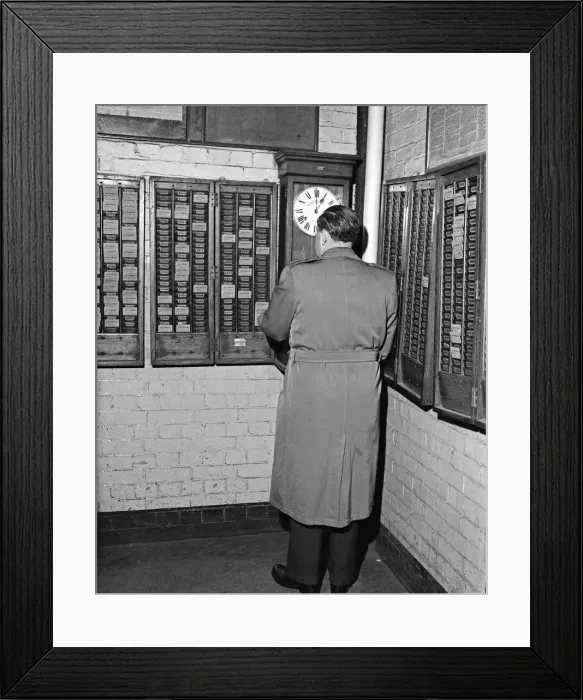 Framed Print : Clocking on at the Daily Herald newspaper offices. 18th December 1959 Framed Print : Clocking on at the Daily Herald newspaper offices. 18th December 1959