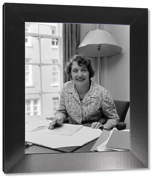 Mrs. Shirley Williams at her desk at the Ministry of Labour at St. James Square